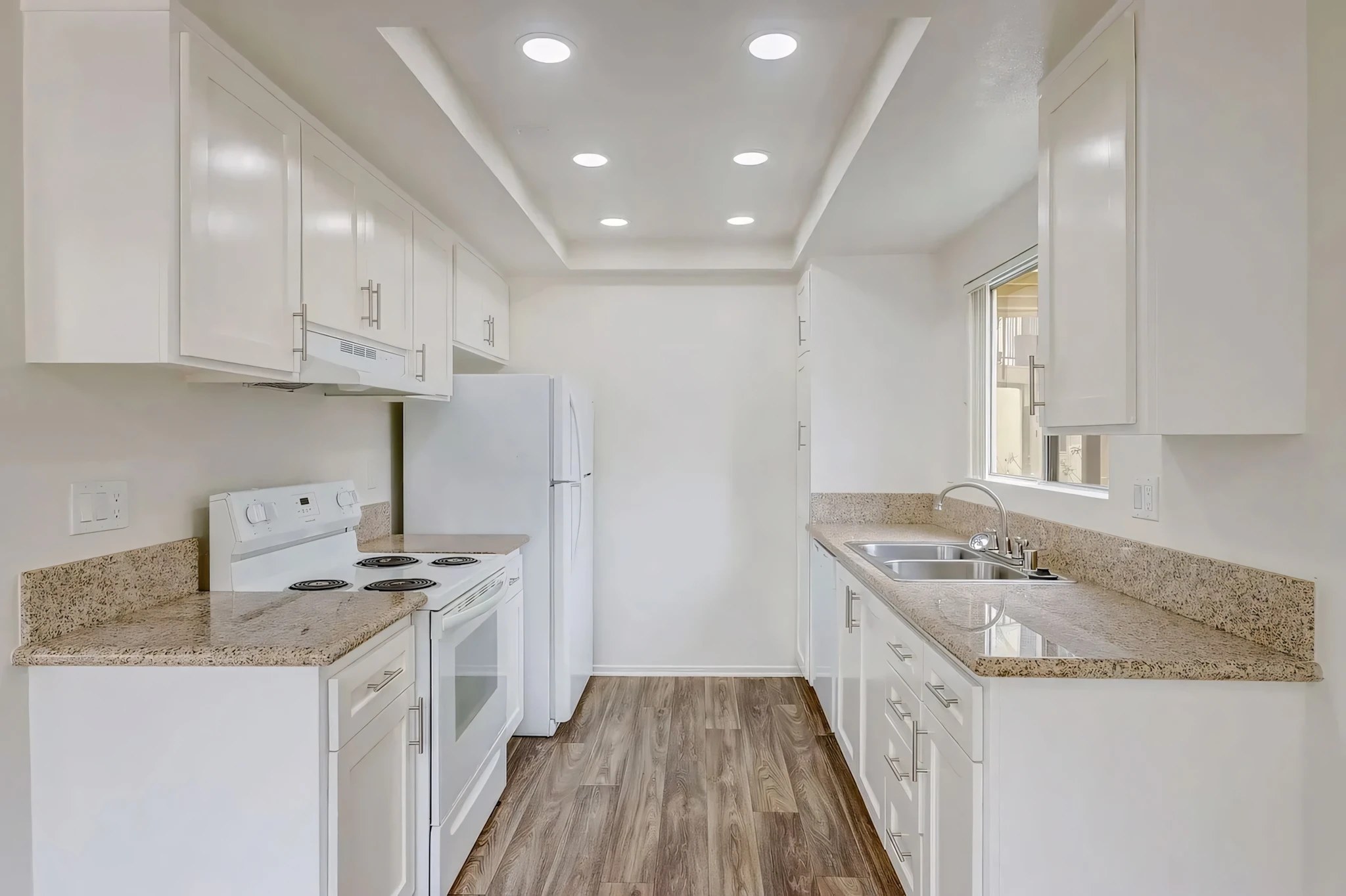 Arbor Park Apartments renovated galley kitchen with granite countertops