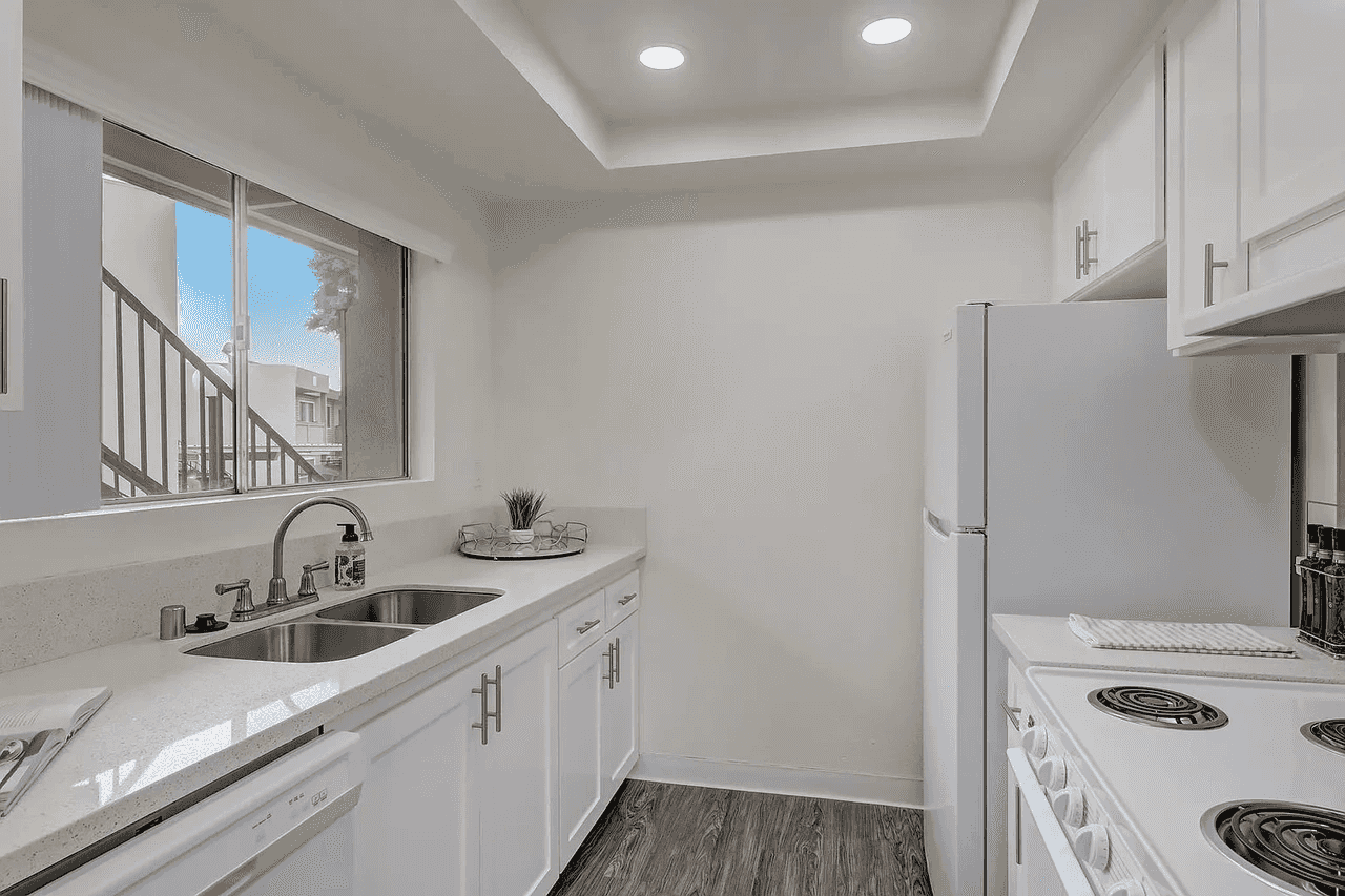 updated kitchen layout with white cabinetry