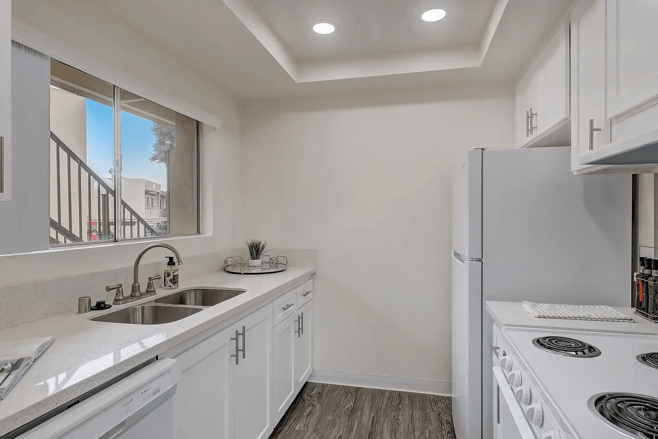 Arbor Park Apartments updated kitchen layout with white cabinetry