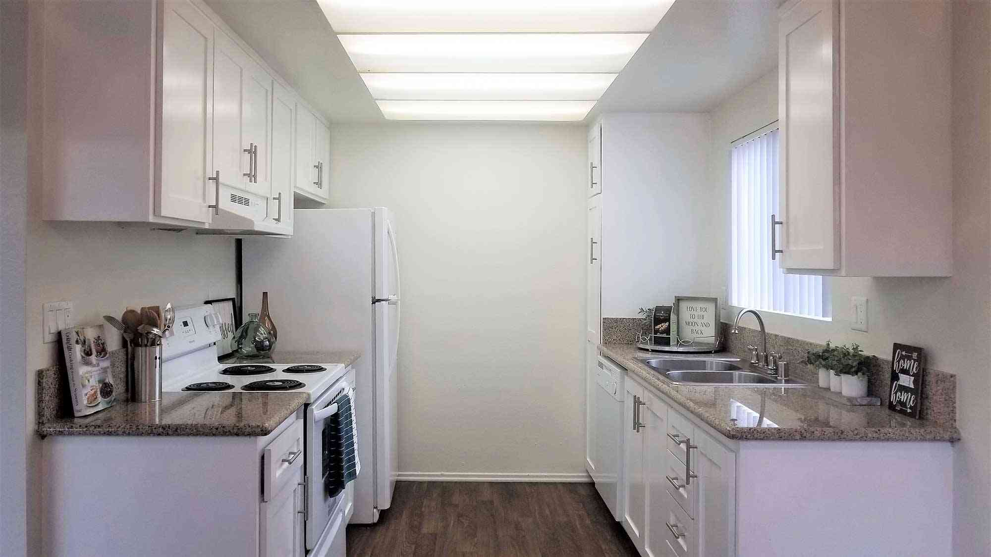 modern kitchen with wood style flooring