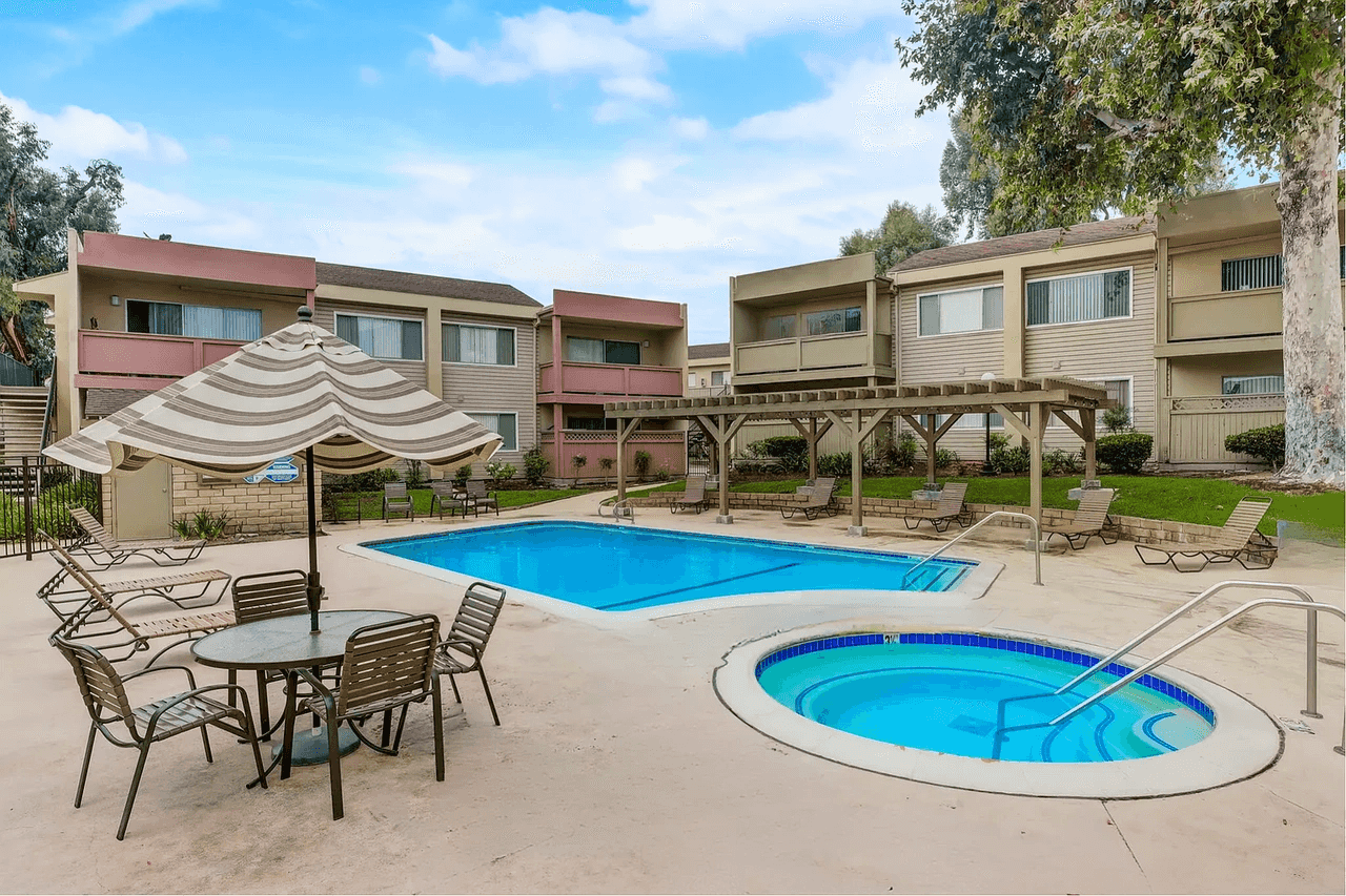 sparkling swimming pool and spa with shaded pergola
