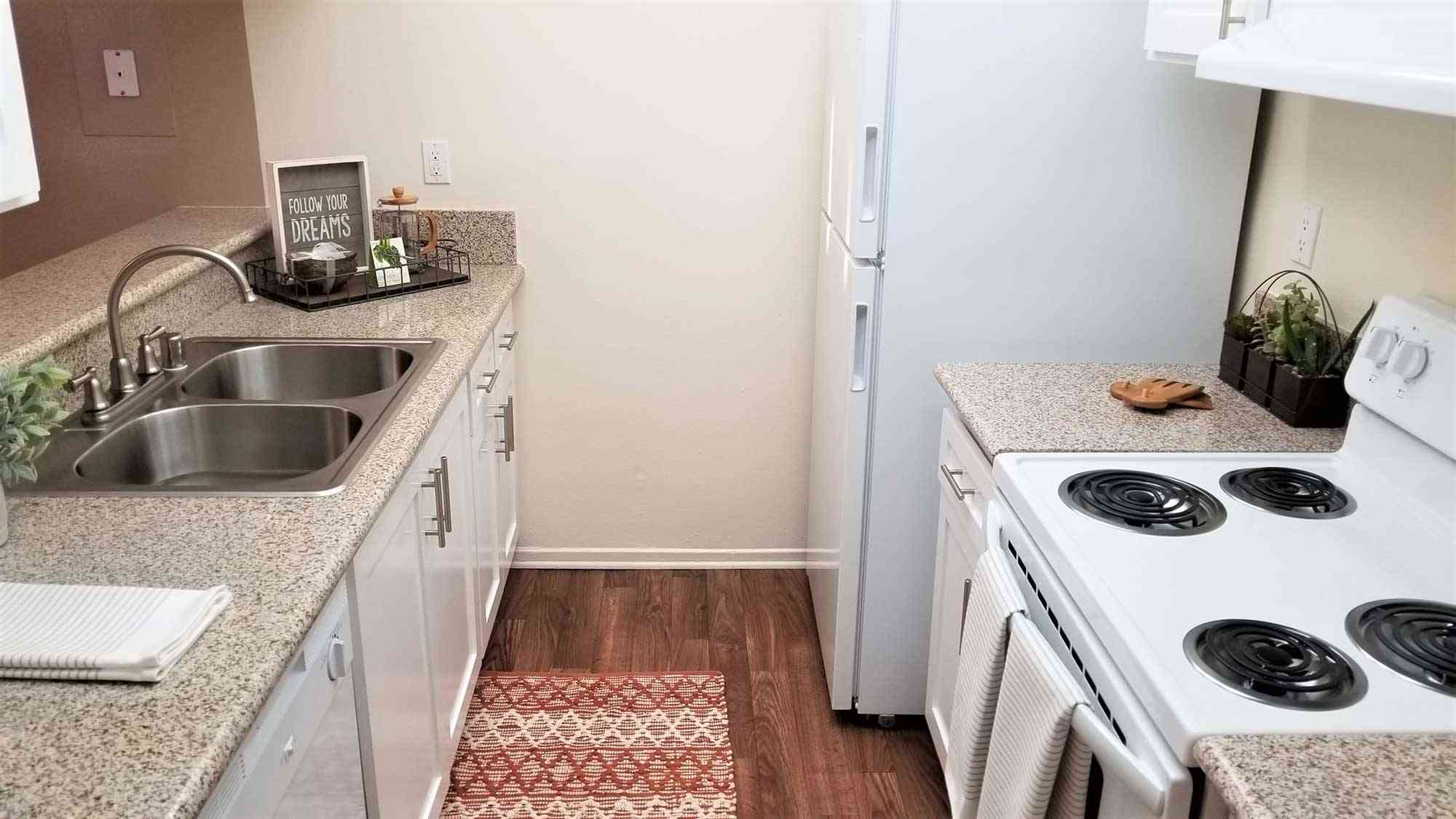 compact galley kitchen with double basin sink