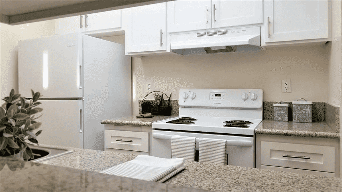 kitchen pass through view with shaker cabinets