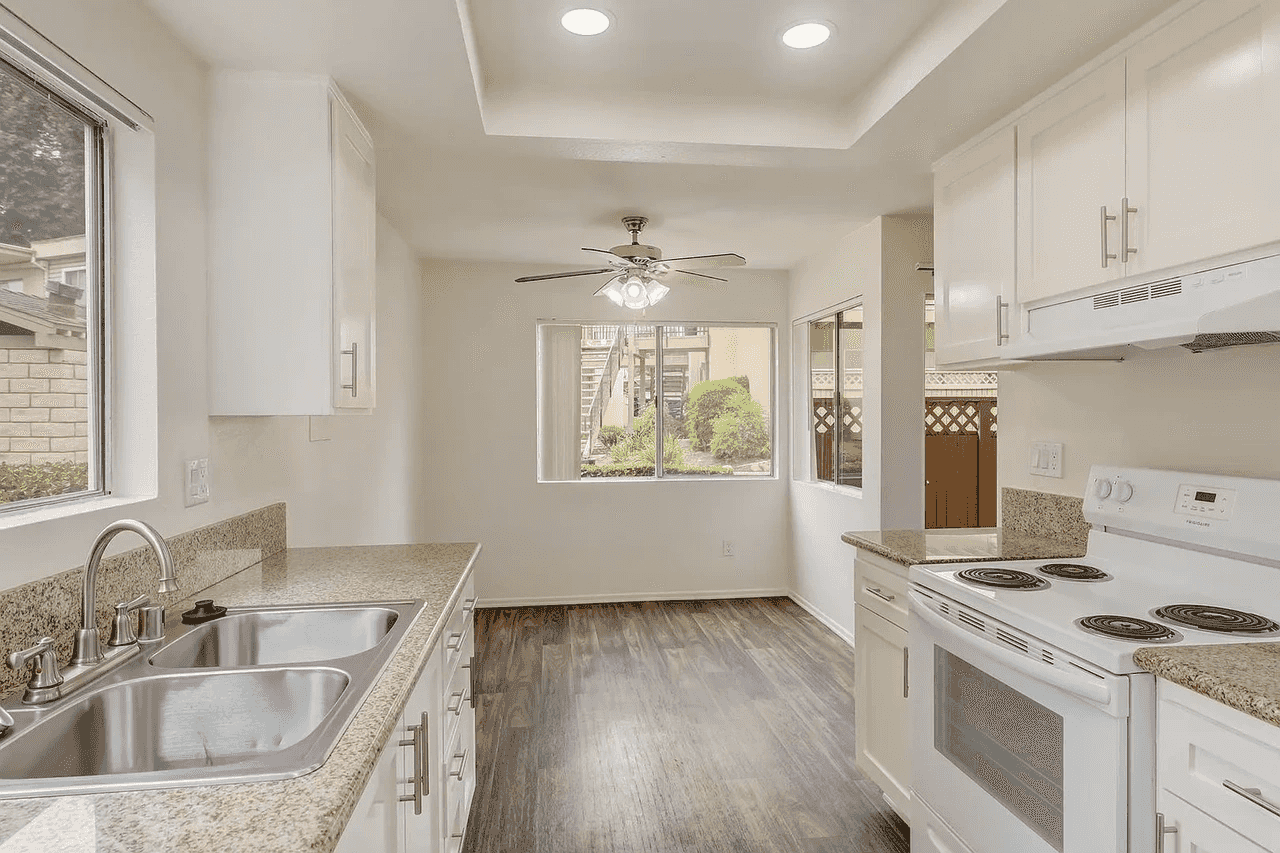 renovated kitchen opening to dining area