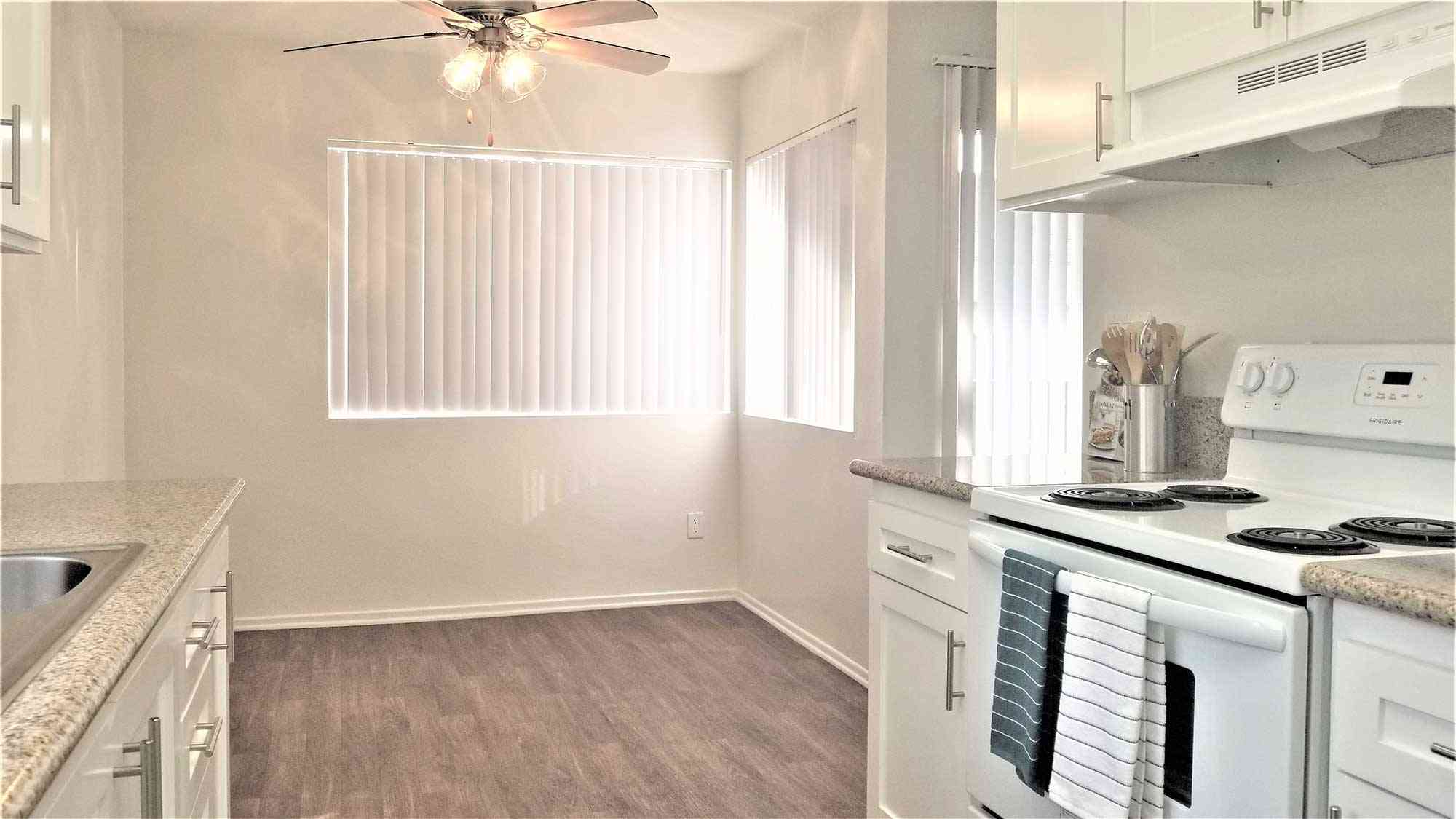 bright dining area with hardwood style flooring