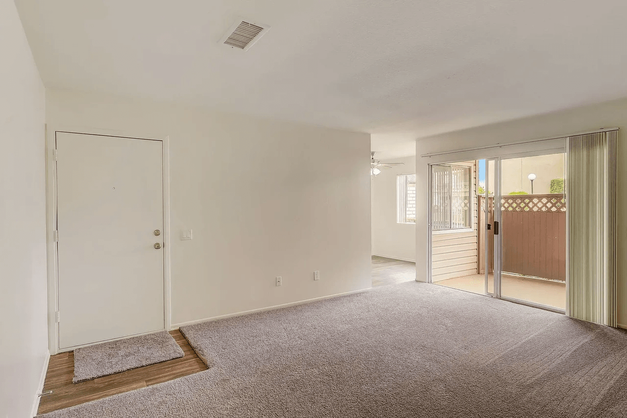 Arbor Park Apartments spacious living room with sliding glass patio door
