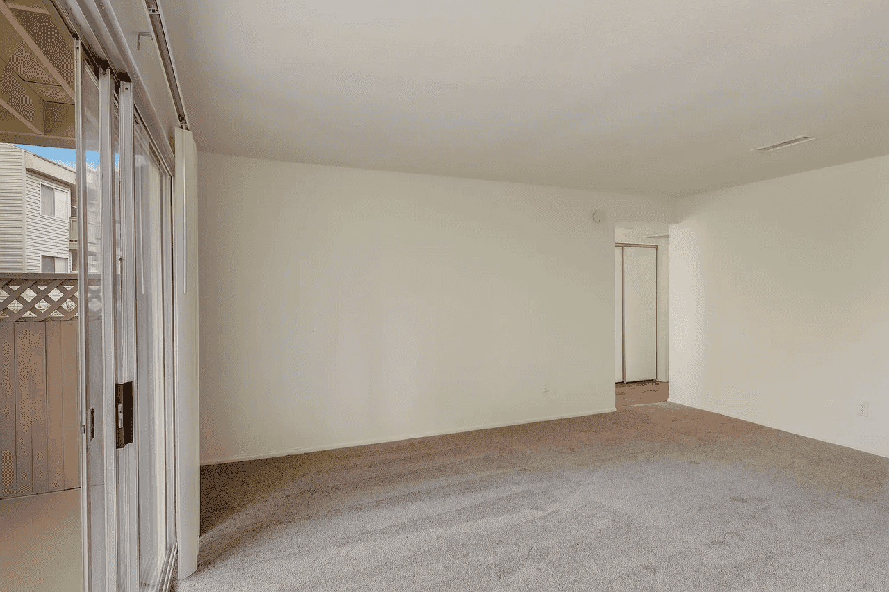 open concept living area with private patio