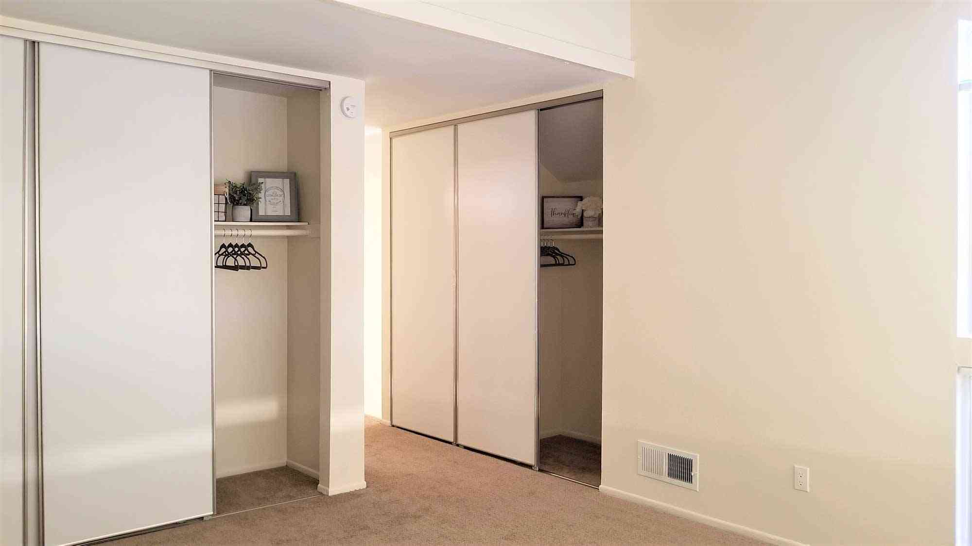 spacious bedroom closets with sliding doors