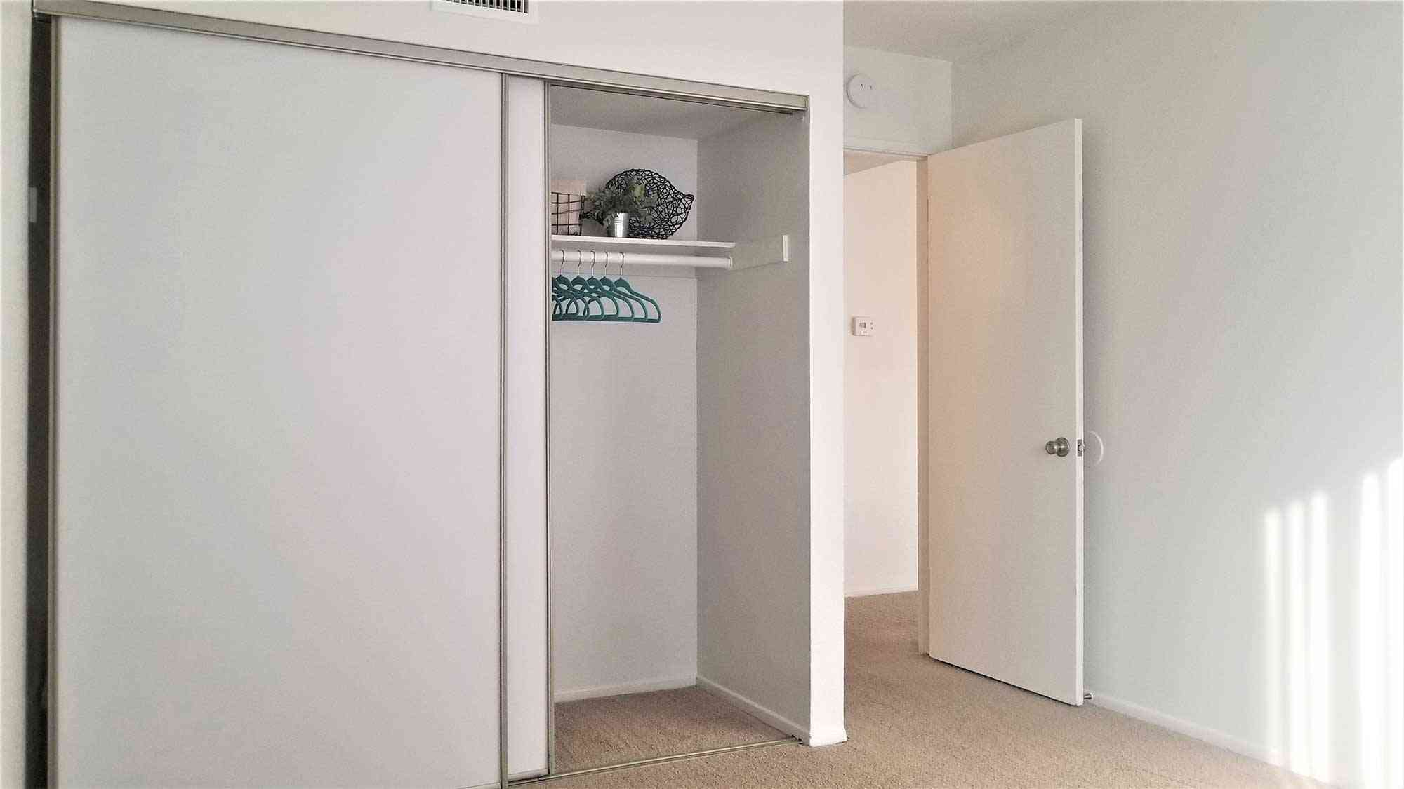 bedroom closet with built in organizers