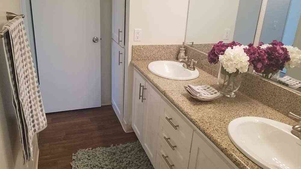 updated bathroom vanity and linen closet storage