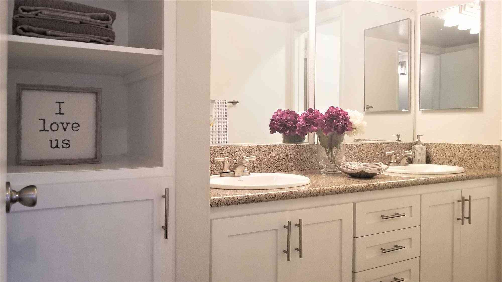 double vanity with built in linen shelving