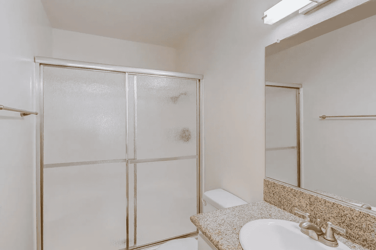 modern bathroom with glass shower enclosure